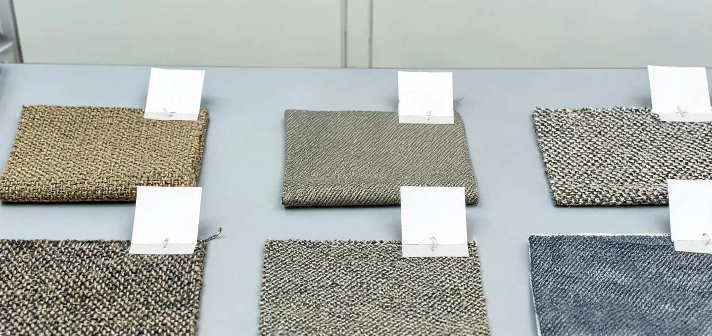 Workwear fabric samples arranged for construction and durability review